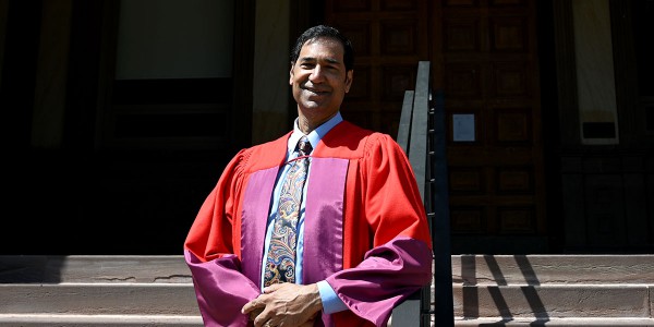 Justice Peter Jamadar standing on the steps of Old Vic.