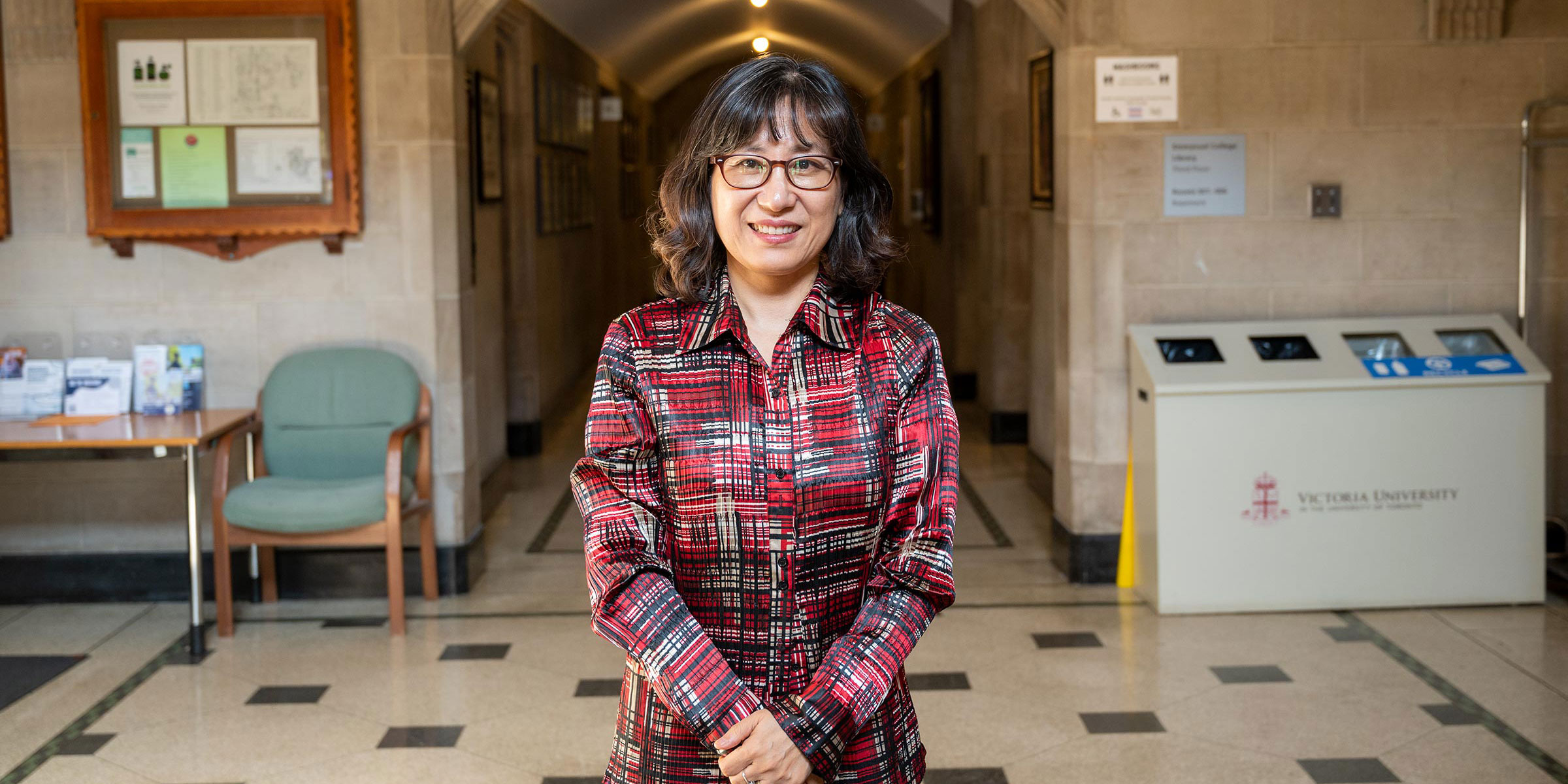 Principal Kim-Cragg stands in the hallway of the Emmanuel College building