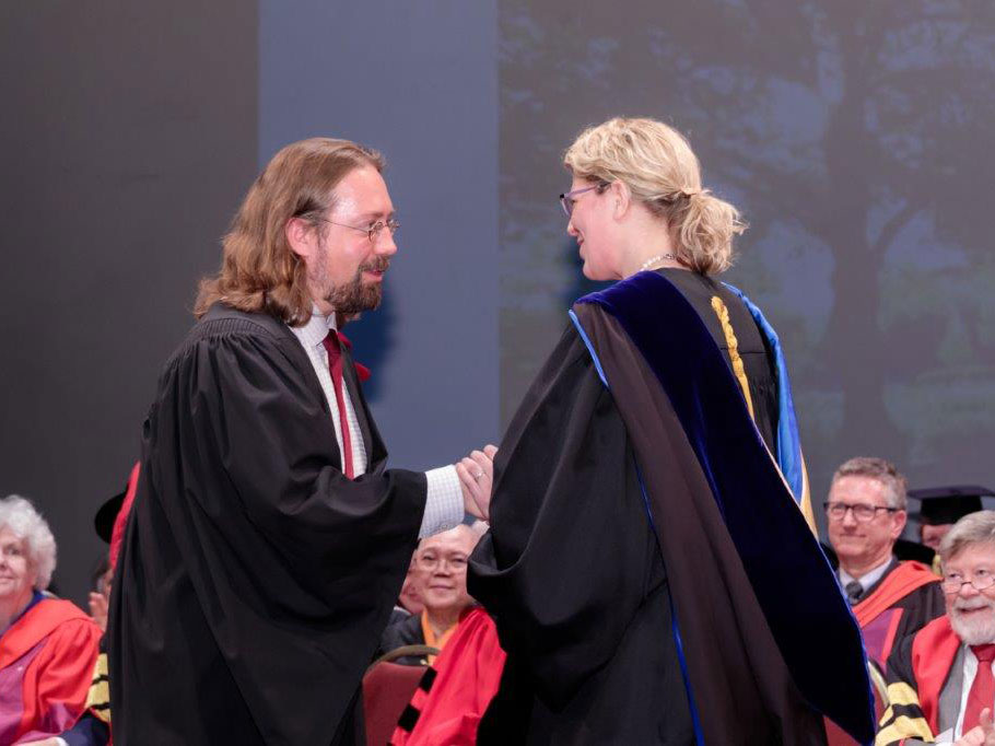 Michelle Voss Roberts congragulates a grad
